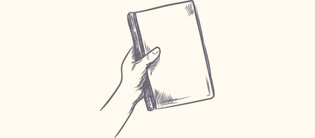 Buch das von einer Hand gehalten wird
